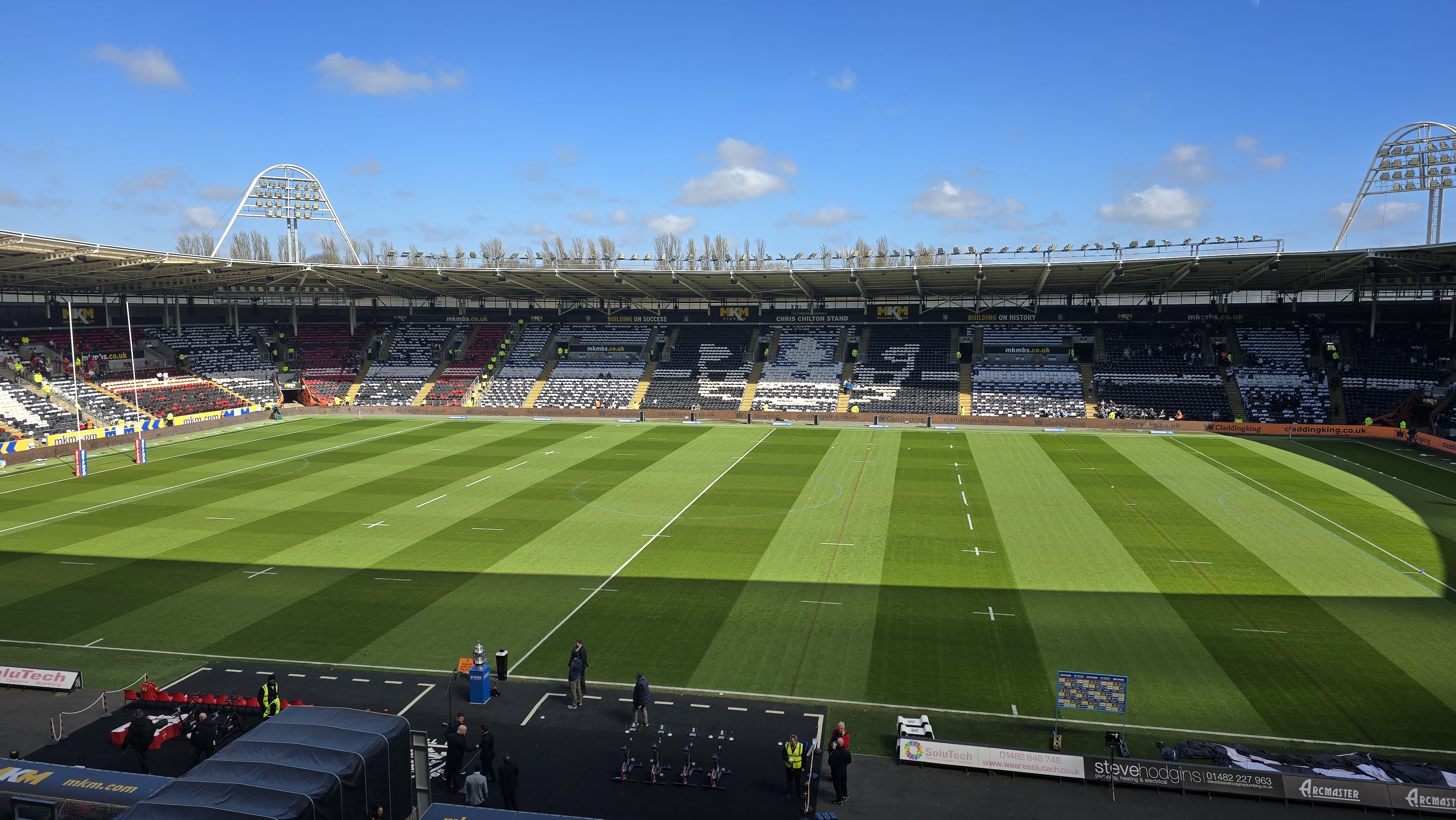 Match report writer taking notes during a live sports event